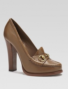Loafer-inspired leather pump with a Gucci horsebit 60th anniversary tag. Stacked heel, 4½ (115mm)Leather upperLeather lining and solePadded insoleMade in Italy Loafer-inspired leather pump with a Gucci horsebit 60th anniversary tag. Stacked heel, 4½ (115mm)Leather upperLeather lining and solePadded insoleMade in Italy