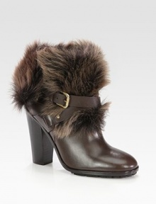 Lush shearling tops this leather silhouette, with a towering stacked heel and wrap-around ankle strap. Stacked heel, 4½ (115mm)Leather and shearling upperAdjustable leather ankle strapLeather liningRubber solePadded insoleMade in ItalyOUR FIT MODEL RECOMMENDS ordering one half size up as this style runs small. Lush shearling tops this leather silhouette, with a towering stacked heel and wrap-around ankle strap. Stacked heel, 4½ (115mm)Leather and shearling upperAdjustable leather ankle strapLeather liningRubber solePadded insoleMade in ItalyOUR FIT MODEL RECOMMENDS ordering one half size up as this style runs small.
