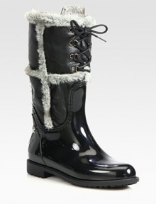 Rubber and leather rain boots are designed for warmth and protection from the elements.Shaft, 11¾Leg circumference, 15Rubber upperTextured nappa leather shaftLace-up frontFaux fur liningPadded insoleRubber tread soleMade in Spain Rubber and leather rain boots are designed for warmth and protection from the elements.Shaft, 11¾Leg circumference, 15Rubber upperTextured nappa leather shaftLace-up frontFaux fur liningPadded insoleRubber tread soleMade in Spain
