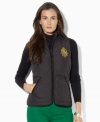 Lauren Ralph Lauren's lightweight petite vest in diamond-quilted microfiber is an essential layering piece for the season, finished with an embroidered crest for heritage charm.