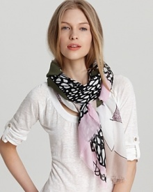 A nature-inspired scarf with earthy tones and leaf print. A nature-inspired scarf with earthy tones and leaf print.
