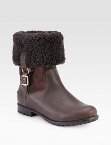 Stay warm wearing this shearling-lined boot made of rich leather and suede with buckled goldtone hardware. Rubber heel, 1 (25mm)Shaft, 11Leg circumference, 13Leather, suede and shearling upperPull-on style with leather adjustable buckle strapShearling liningRubber trek solePadded insoleImported Stay warm wearing this shearling-lined boot made of rich leather and suede with buckled goldtone hardware. Rubber heel, 1 (25mm)Shaft, 11Leg circumference, 13Leather, suede and shearling upperPull-on style with leather adjustable buckle strapShearling liningRubber trek solePadded insoleImported