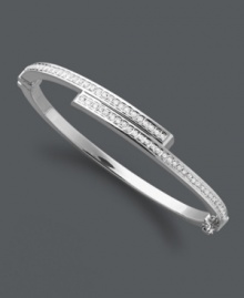 Sparkling sophistication. This subtly shimmering style features a unique bypass design accented by round-cut diamonds. Set in sterling silver with a slip-on hinge clasp. Approximate length: 7 inches. Sparkling sophistication. This subtly shimmering style features a unique bypass design accented by round-cut diamonds. Set in sterling silver with a slip-on hinge clasp. Approximate length: 7 inches.