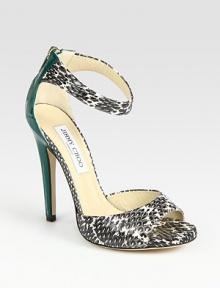 Elegant snakeskin silhouette with a wrap-around ankle strap, contrasting patent leather heel and an exposed back zipper. Patent leather heel, 5 (125mm)Covered platform, ½ (15mm)Compares to a 4½ heel (115mm)Snakeskin and patent leather upperBack zipperLeather lining and solePadded insoleMade in ItalyOUR FIT MODEL RECOMMENDS ordering true size. Elegant snakeskin silhouette with a wrap-around ankle strap, contrasting patent leather heel and an exposed back zipper. Patent leather heel, 5 (125mm)Covered platform, ½ (15mm)Compares to a 4½ heel (115mm)Snakeskin and patent leather upperBack zipperLeather lining and solePadded insoleMade in ItalyOUR FIT MODEL RECOMMENDS ordering true size.