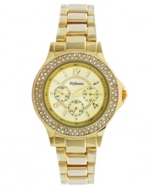 Shimmer and shine with this regal watch by Style&co. Gold tone mixed metal bracelet and round case. Bezel embellished with crystal accents. Champagne dial features numerals at twelve, four and eight o'clock, stick indices, minute track, three multifunctional subdials and logo. Quartz movement. Two-year limited warranty. Shimmer and shine with this regal watch by Style&co. Gold tone mixed metal bracelet and round case. Bezel embellished with crystal accents. Champagne dial features numerals at twelve, four and eight o'clock, stick indices, minute track, three multifunctional subdials and logo. Quartz movement. Two-year limited warranty.