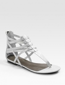 A strappy structure made of metallic leather has an electric effect on the ensemble.Back zipper Leather lining and sole Padded insole Imported A strappy structure made of metallic leather has an electric effect on the ensemble.Back zipper Leather lining and sole Padded insole Imported