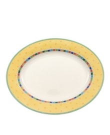 Spice up your main disheds with the Twist Alea oval platter. The bright enamel colorblock design is a perfect contrast to the fine white china. Features a vivid band of color along the rim.