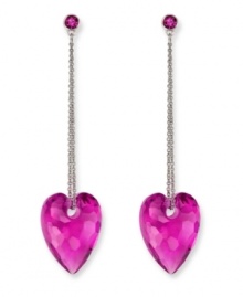 Embrace your playful, romantic side. Swarovski's drop-shaped earrings feature a beautiful, puffed heart silhouette on a stainless steel chain. Created in Fuchsia crystal in an exclusive cut. Approximate drop: 2-1/4 inches. Embrace your playful, romantic side. Swarovski's drop-shaped earrings feature a beautiful, puffed heart silhouette on a stainless steel chain. Created in Fuchsia crystal in an exclusive cut. Approximate drop: 2-1/4 inches.