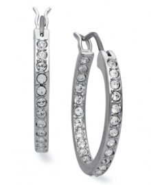 Classic elegance, inside and out. These hoop earrings from Swarovski illuminate all occasions with clear crystal pave. Crafted in rhodium-plated mixed metal. Approximate diameter: 3/4 inch. Classic elegance, inside and out. These hoop earrings from Swarovski illuminate all occasions with clear crystal pave. Crafted in rhodium-plated mixed metal. Approximate diameter: 3/4 inch.