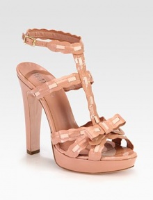 Scalloped edges and a pretty bow infuse retro-femininity into this patent design, with smooth leather trim and a towering heel. Patent leather-covered heel, 5 (125mm)Patent leather platform, 1 (25mm)Compares to a 4 heel (100mm)Patent leather upper with calfskin leather trimAdjustable ankle strapLeather lining and solePadded insoleMade in Italy Scalloped edges and a pretty bow infuse retro-femininity into this patent design, with smooth leather trim and a towering heel. Patent leather-covered heel, 5 (125mm)Patent leather platform, 1 (25mm)Compares to a 4 heel (100mm)Patent leather upper with calfskin leather trimAdjustable ankle strapLeather lining and solePadded insoleMade in Italy