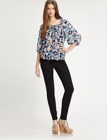 Sweet sophistication-- this floral-print silk scoopneck has a front tie, hi-low hem and dramatic bishop sleeves. Scoopneck with tie detailThree-quarter bishop sleevesHi-low hemSilkDry cleanImportedModel shown is 5'10 (177cm) wearing US size 4.