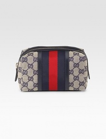 Medium cosmetic case in GG fabric with web detail, leather trim, and light goldtone hardware.Zip-top closure One inside open pocket Fully lined 7W X 4¾H X 3½D Made in Italy Medium cosmetic case in GG fabric with web detail, leather trim, and light goldtone hardware.Zip-top closure One inside open pocket Fully lined 7W X 4¾H X 3½D Made in Italy