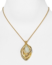 Alexis Bittar's crystal encrusted gold setting perfectly presents a beautiful pale green stone. The asymmetrical pendant deserves a permanent place in your jewelry rotation. Alexis Bittar's crystal encrusted gold setting perfectly presents a beautiful pale green stone. The asymmetrical pendant deserves a permanent place in your jewelry rotation.