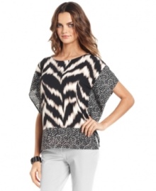 Alfani's poncho packs stylish punch with a luxe animal print and contrasting patterned border. Alfani's poncho packs stylish punch with a luxe animal print and contrasting patterned border.