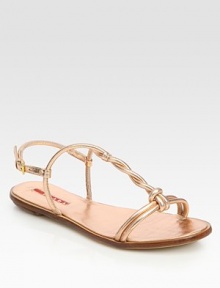 Metallic leather twist t-strap design with a leather sole. Metallic leather upperLeather lining and solePadded insoleImported Metallic leather twist t-strap design with a leather sole. Metallic leather upperLeather lining and solePadded insoleImported