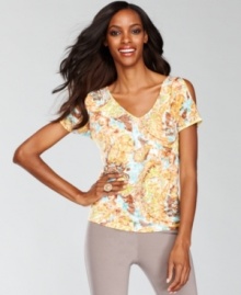 An abstract print, shiny studding and split-sleeve detail makes this petite top from INC super striking. An abstract print, shiny studding and split-sleeve detail makes this petite top from INC super striking.