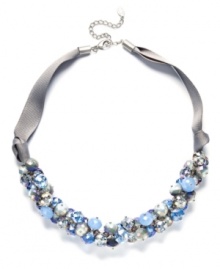 Shake up your style with c.A.K.e. by Ali Khan's shimmery cluster necklace. Blue and clear crystal beads (10-14 mm) add a sparkling effect to a trendy grosgrain ribbon and mixed metal setting. Approximate length: 18 inches + 3-inch extender. Shake up your style with c.A.K.e. by Ali Khan's shimmery cluster necklace. Blue and clear crystal beads (10-14 mm) add a sparkling effect to a trendy grosgrain ribbon and mixed metal setting. Approximate length: 18 inches + 3-inch extender.