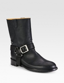 Instantly cool leather staple with an equestrian-inspired harness detail and adjustable buckle strap. Stacked heel, 1¼ (30mm)Shaft, 8½Leg circumference, 12½Leather upperPull-on style with adjustable buckle strapLeather liningRubber solePadded insoleMade in Italy