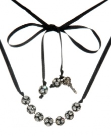 Be queen of the disco and bring the party wherever you go. Betsey Johnson's flashy design features seven sparkling fireballs strung on a delicate black ribbon. Ribbon ends decorated with fireball and charm accents. Crafted in black-plated mixed metal. Approximate length: 32 inches. Be queen of the disco and bring the party wherever you go. Betsey Johnson's flashy design features seven sparkling fireballs strung on a delicate black ribbon. Ribbon ends decorated with fireball and charm accents. Crafted in black-plated mixed metal. Approximate length: 32 inches.