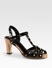 Patent leather silhouette with goldtone studs and a cork heel. Cork heel, 3 (75mm)Patent leather upper with metal studsAdjustable ankle strapLeather lining and solePadded insoleMade in Italy Patent leather silhouette with goldtone studs and a cork heel. Cork heel, 3 (75mm)Patent leather upper with metal studsAdjustable ankle strapLeather lining and solePadded insoleMade in Italy