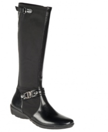 Tally-ho! The military-inspired Adrienne riding boots feature a smooth, rounded toe and logo buckle embellishment for a fabulous, yet comfortable addition to your wardrobe. Tally-ho! The military-inspired Adrienne riding boots feature a smooth, rounded toe and logo buckle embellishment for a fabulous, yet comfortable addition to your wardrobe.