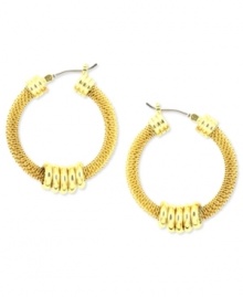 Add some texture to a classic look. Anne Klein's hoop earrings shake things up with textured mesh and shiny accents. Crafted in gold tone mixed metal. Approximate diameter: 2-1/2 inches. Add some texture to a classic look. Anne Klein's hoop earrings shake things up with textured mesh and shiny accents. Crafted in gold tone mixed metal. Approximate diameter: 2-1/2 inches.