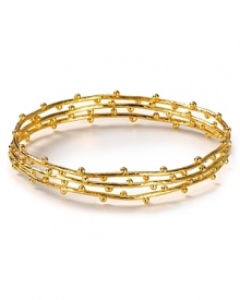 Stackable bangles from Gorjana in 18-karat gold vermeil are a delicate touch - now imagine how they stand out featuring delicate dot details. Stackable bangles from Gorjana in 18-karat gold vermeil are a delicate touch - now imagine how they stand out featuring delicate dot details.