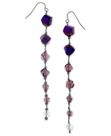 Purple beads lead the way to modern style. These drop earrings from GUESS features amethyst glass beads on a linear silhouette. Crafted in hematite tone mixed metal. Approximate drop: 4 inches. Purple beads lead the way to modern style. These drop earrings from GUESS features amethyst glass beads on a linear silhouette. Crafted in hematite tone mixed metal. Approximate drop: 4 inches.