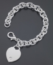 Sometimes love can be so simple. This gorgeous GUESS bracelet is crafted in polished silvertone mixed metal with a logo heart charm. Approximate length: 7-1/4 inches. Sometimes love can be so simple. This gorgeous GUESS bracelet is crafted in polished silvertone mixed metal with a logo heart charm. Approximate length: 7-1/4 inches.