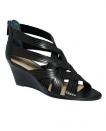 A sophisticated twist. Summer style takes a dressy turn thanks to Bandolino's Janeera wedge sandals. With a zipper closure at back, they feature a wearable stacked wedge heel. A sophisticated twist. Summer style takes a dressy turn thanks to Bandolino's Janeera wedge sandals. With a zipper closure at back, they feature a wearable stacked wedge heel.