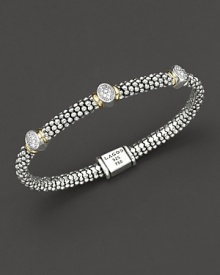 From the Twilight collection, thin caviar rope bracelet with three oval diamond pavé stations and gold accents. Designed by Lagos. From the Twilight collection, thin caviar rope bracelet with three oval diamond pavé stations and gold accents. Designed by Lagos.