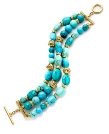 The vibrant look of turquoise overtakes this lovely bracelet from Lauren Ralph Lauren. The three-row design showcases reconstituted turquoise beads and open work metal accents. Ring and toggle closure. Crafted in 14k gold-plated mixed metal. Approximate length: 7-3/4 inches. The vibrant look of turquoise overtakes this lovely bracelet from Lauren Ralph Lauren. The three-row design showcases reconstituted turquoise beads and open work metal accents. Ring and toggle closure. Crafted in 14k gold-plated mixed metal. Approximate length: 7-3/4 inches.