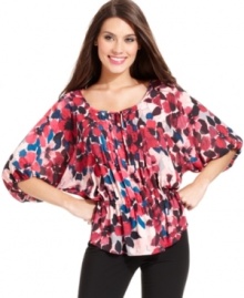 Alfani's pretty peasant top glows with a vibrant floral print and special details, like a pleated front placket. Alfani's pretty peasant top glows with a vibrant floral print and special details, like a pleated front placket.