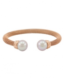 Lovely and luxurious. Crafted in rich rose gold tone stainless steel, Majorica's beautiful bangle bracelet is enhanced by organic man-made pearls. Wear it anytime you want to add extra elegance to your look. Approximate diameter: 2-1/2 inches. Lovely and luxurious. Crafted in rich rose gold tone stainless steel, Majorica's beautiful bangle bracelet is enhanced by organic man-made pearls. Wear it anytime you want to add extra elegance to your look. Approximate diameter: 2-1/2 inches.