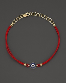 Diamonds and blue sapphires in 14K. yellow gold from a dazzling evil eye charm, strung on red rope. By Meira T. Diamonds and blue sapphires in 14K. yellow gold from a dazzling evil eye charm, strung on red rope. By Meira T.