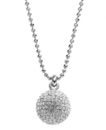 On the ball. This trendy long pendant by Michael Kors puts the chic back into disco with pave-set crystal accents and a silver tone mixed metal setting. Pendant strung from a ball chain with a toggle clasp and MK lock charm. Approximate length: 32 inches. Approximate drop: 5/6 inch. On the ball. This trendy long pendant by Michael Kors puts the chic back into disco with pave-set crystal accents and a silver tone mixed metal setting. Pendant strung from a ball chain with a toggle clasp and MK lock charm. Approximate length: 32 inches. Approximate drop: 5/6 inch.