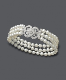 Traditional, stately, and timeless. This unique, three-row bracelet shimmers with the addition of cultured freshwater pearls (4-1/2 mm) and an ornate, diamond-coated clasp (1/6 ct. t.w.). Approximate length: 7 inches. Traditional, stately, and timeless. This unique, three-row bracelet shimmers with the addition of cultured freshwater pearls (4-1/2 mm) and an ornate, diamond-coated clasp (1/6 ct. t.w.). Approximate length: 7 inches.