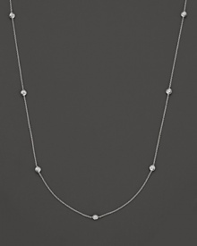 A white gold necklace with seven bezel-set diamond stations; with signature ruby accent. Designed by Roberto Coin. A white gold necklace with seven bezel-set diamond stations; with signature ruby accent. Designed by Roberto Coin.