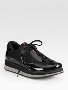 A multi-color micro-foam sole elevates this patent leather and mesh lace-up style. Rubber wedge with micro-foam insert, 1 (25mm)Rubber platform with micro-foam insert, ½ (15mm)Compares to a ½ heel (15mm)Patent leather and mesh upperLeather liningRubber solePadded insoleImported A multi-color micro-foam sole elevates this patent leather and mesh lace-up style. Rubber wedge with micro-foam insert, 1 (25mm)Rubber platform with micro-foam insert, ½ (15mm)Compares to a ½ heel (15mm)Patent leather and mesh upperLeather liningRubber solePadded insoleImported