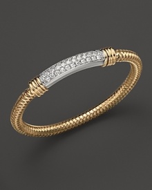Sparkling diamonds decorate a gleaming 18K gold Roberto Coin bracelet. Sparkling diamonds decorate a gleaming 18K gold Roberto Coin bracelet.