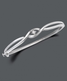 Simplicity and style twisted into one. Bangle by Wrapped in Love(tm) features two bands of sterling silver sweeping past one another with a glittering round-cut diamond (1/10 ct. t.w.) at their intersection. Approximate width: 2-3/8 inches. Simplicity and style twisted into one. Bangle by Wrapped in Love(tm) features two bands of sterling silver sweeping past one another with a glittering round-cut diamond (1/10 ct. t.w.) at their intersection. Approximate width: 2-3/8 inches.