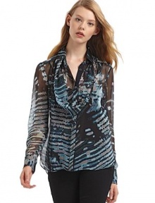 THE LOOKAbstract pattern throughoutRemovable scarf with grosgrain ribbonPoint collarButton frontLong sleeves with two-button cuffsShirttail hemSolid color camisoleTHE FITAbout 27 from shoulder to hemTHE MATERIALSilkCARE & ORIGINDry cleanMade in USA of imported fabric