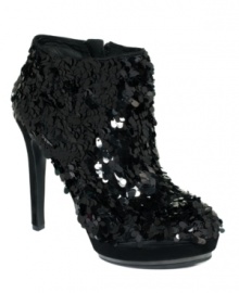 Vince Camuto's Dira platform booties feature all-over sequins for a look that's as festive as it is luxurious. Vince Camuto's Dira platform booties feature all-over sequins for a look that's as festive as it is luxurious.