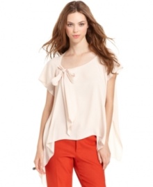 A bow-tie and flowy A-line shape makes this RACHEL Rachel Roy blouse an oh-so feminine topper over the season's skinny jeans! A bow-tie and flowy A-line shape makes this RACHEL Rachel Roy blouse an oh-so feminine topper over the season's skinny jeans!