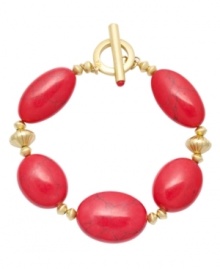 Revive your style. Lauren by Ralph Lauren's bold and bright design features reconstituted coral beads. Setting and toggle clasp crafted in gold tone mixed metal. Approximate length: 8 inches. Revive your style. Lauren by Ralph Lauren's bold and bright design features reconstituted coral beads. Setting and toggle clasp crafted in gold tone mixed metal. Approximate length: 8 inches.