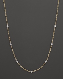 A yellow and white gold necklace with bezel-set diamond stations. With signature ruby accent. Designed by Roberto Coin. A yellow and white gold necklace with bezel-set diamond stations. With signature ruby accent. Designed by Roberto Coin.
