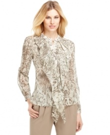 Make a statement in this chic blouse from Jones New York, featuring on-trend animal print and a feminine ruffle at the front. Make a statement in this chic blouse from Jones New York, featuring on-trend animal print and a feminine ruffle at the front.