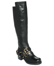The belted harness around the ankle of Lisa for Donald Pliner's Adait tall riding boots adds eye-catching detail to this smooth, tall style. The belted harness around the ankle of Lisa for Donald Pliner's Adait tall riding boots adds eye-catching detail to this smooth, tall style.