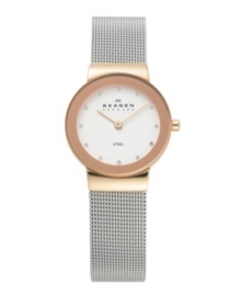Steel and rose gold create a stunning combination on this lovely watch by Skagen Denmark. Stainless steel mesh bracelet and round rose gold tone case. Silver tone dial features Swarovski elements at markers, two rose gold tone hands and logo. Quartz movement. Water resistant to 30 meters. Limited lifetime warranty. Steel and rose gold create a stunning combination on this lovely watch by Skagen Denmark. Stainless steel mesh bracelet and round rose gold tone case. Silver tone dial features Swarovski elements at markers, two rose gold tone hands and logo. Quartz movement. Water resistant to 30 meters. Limited lifetime warranty.