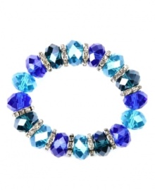Drink in the cool blues! Captivating with tonal blue plastic beads, Nine West's stretch bracelet also boasts silver tone rondelles with clear crystal accents. Bracelet stretches to fit wrist. Crafted in imitation rhodium-plated mixed metal. Approximate diameter: 2 inches. Drink in the cool blues! Captivating with tonal blue plastic beads, Nine West's stretch bracelet also boasts silver tone rondelles with clear crystal accents. Bracelet stretches to fit wrist. Crafted in imitation rhodium-plated mixed metal. Approximate diameter: 2 inches.
